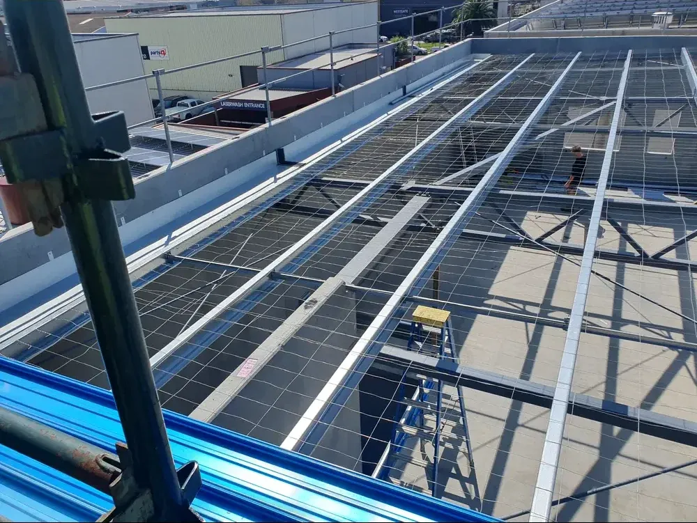 Rooftop plumbing work at a commercial site