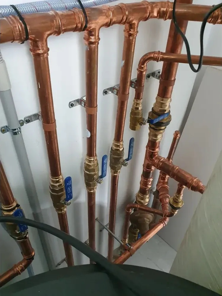 Copper pipework and valves installed at a commercial car wash